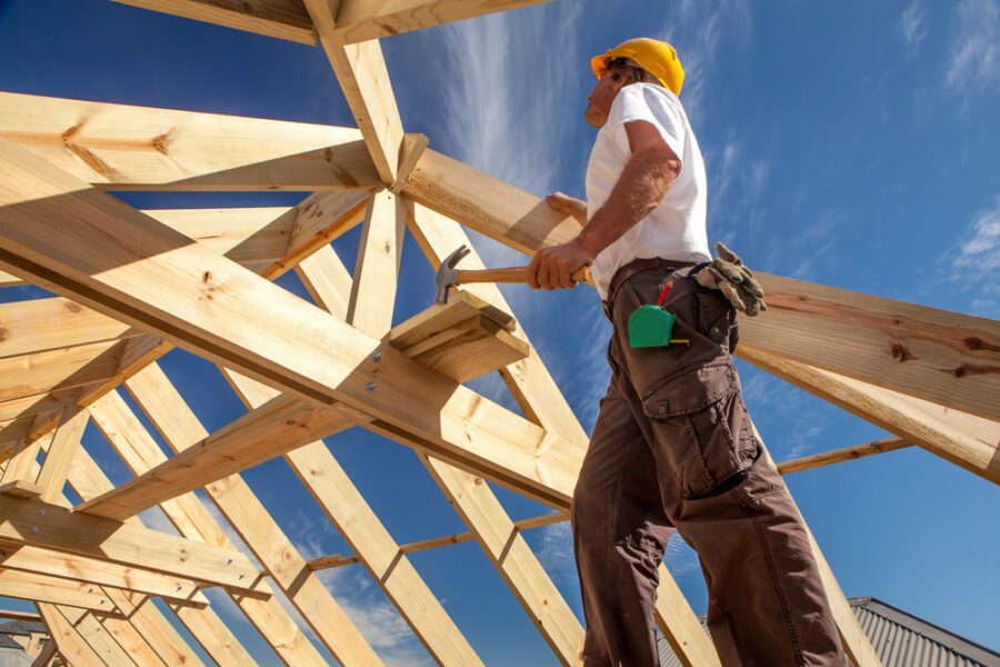 Builder working on a wooden roof