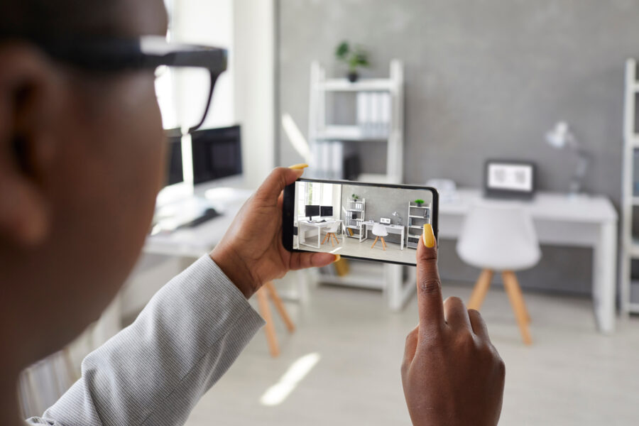 Man filming house with phone